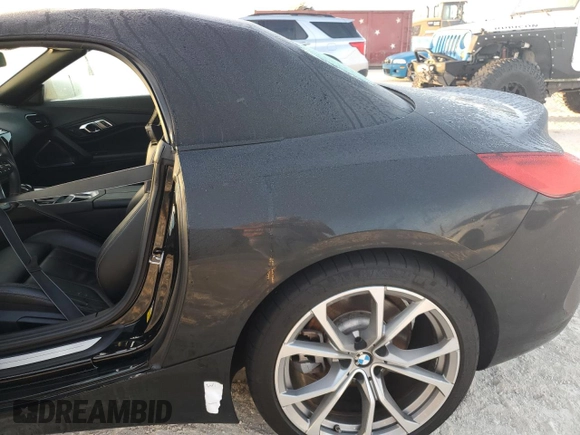 2020 BMW Z4 sDrive30i with VIN WBAHF3C03LWW64905, listed as a Copart auction lot 77010554 with 27,612 mi miles and Salvage Title. Bid and sale history available at carsss.com. Image 12.