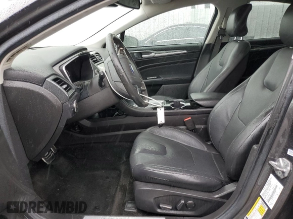 2016 Ford Fusion Titanium Hybrid z VIN 3FA6P0RU5GR356987, wystawiony jako Copart lot #48211775 z przebiegiem 145 192 mil mil oraz Szkoda całkowita • Salvage title. Historia ofert i sprzedaży dostępna na DreamBid. Obrazek 7.