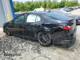 2025 Toyota Camry LE z VIN 4T1DAACKXSU089259, wystawiony jako Copart lot #59180765 z przebiegiem 9 242 mil mil oraz Czysty tytuł • Clean title. Historia ofert i sprzedaży dostępna na DreamBid. Obrazek 2.