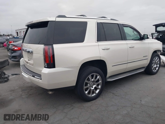2015 GMC Yukon Denali with VIN 1GKS2CKJ9FR294551, listed as a IAAI auction lot 42162654 with 106,063 mi miles. Bid and sale history available at carsss.com. Image 4.