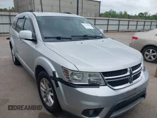 2014 Dodge Journey SXT with VIN 3C4PDCBG1ET107759, listed as a IAAI auction lot 41928288 with 145,014 mi miles. Bid and sale history available at carsss.com. Image 1.