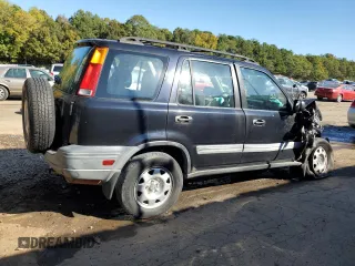 1999 Honda CR-V LX with VIN JHLRD2847XC021888, listed as a Copart auction lot 76556164 with 285,517 mi miles and Salvage Title. Bid and sale history available at carsss.com. Image 3.