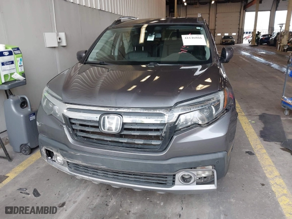 2017 Honda Ridgeline RTL-E with VIN 5FPYK3F73HB034764, listed as a IAAI auction lot 41146866 with 125,885 mi miles. Bid and sale history available at carsss.com. Image 12.