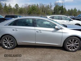 2013 Cadillac XTS Luxury z VIN 2G61P5S33D9170453, wystawiony jako IAAI lot #41928607 z przebiegiem 68 094 mil mil oraz . Historia ofert i sprzedaży dostępna na DreamBid. Obrazek 13.
