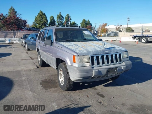 1996 Jeep Grand Cherokee Laredo with VIN 1J4FX58S8TC169575, listed as a IAAI auction lot 40971134 with 152,116 mi miles. Bid and sale history available at carsss.com. Image 1.