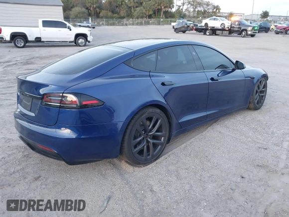 2023 Tesla Model S with VIN 5YJSA1E53PF518986, listed as a IAAI auction lot 41223046 with 22,204 mi miles and . Bid and sale history available at DreamBid. Image 4.