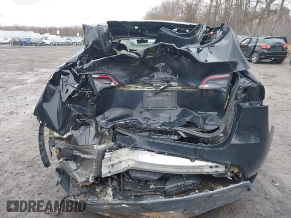 2022 Tesla Model Y Long Range with VIN 7SAYGDEE5NA016892, listed as a IAAI auction lot 41936735 with 69,136 mi miles and . Bid and sale history available at DreamBid. Image 19.
