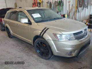 2011 Dodge Journey Crew with VIN 3D4PG3FGXBT571892, listed as a IAAI auction lot 42642259 with 197,749 mi miles and . Bid and sale history available at DreamBid. Image 1.