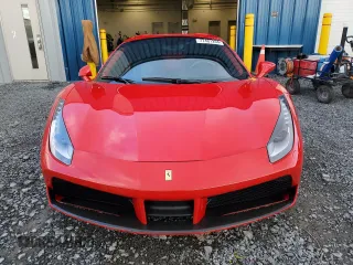 2017 Ferrari 488 z VIN ZFF80AMA6H0228173, wystawiony jako Copart lot #77401204 z przebiegiem 16 556 mil mil oraz Tytuł czysty. Historia ofert i sprzedaży dostępna na DreamBid. Obrazek 5.