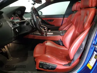 2016 BMW M6 z VIN WBS6E9C53GGF92658, wystawiony jako Copart lot #79003953 z przebiegiem 49 231 mil mil oraz . Historia ofert i sprzedaży dostępna na DreamBid. Obrazek 7.