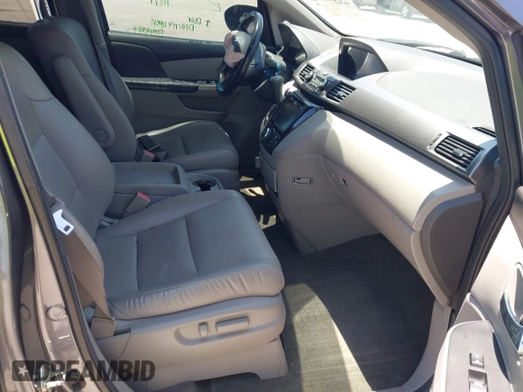 2014 Honda Odyssey EX-L z VIN 5FNRL5H69EB095297, wystawiony jako IAAI lot #42299438 z przebiegiem 126 841 mil mil oraz . Historia ofert i sprzedaży dostępna na DreamBid. Obrazek 5.