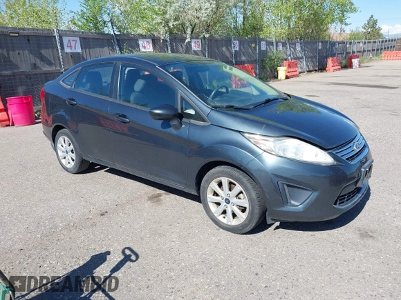 2011 Ford Fiesta SE with VIN 3FADP4BJ7BM135864, listed as a IAAI auction lot 42134479 with 118,573 mi miles. Bid and sale history available at carsss.com. Image 1.