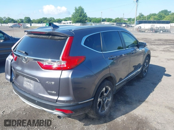 2018 Honda CR-V Touring z VIN 5J6RW2H93JL004834, wystawiony jako IAAI lot #42351364 z przebiegiem 63 746 mil mil oraz . Historia ofert i sprzedaży dostępna na DreamBid. Obrazek 4.