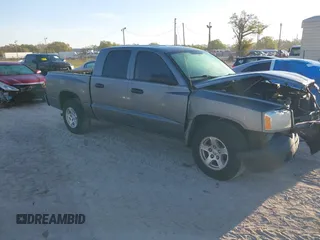 2006 Dodge Dakota ST z VIN 1D7HE28K06S679521, wystawiony jako IAAI lot #41719717 z przebiegiem 130 612 mil mil oraz . Historia ofert i sprzedaży dostępna na DreamBid. Obrazek 1.