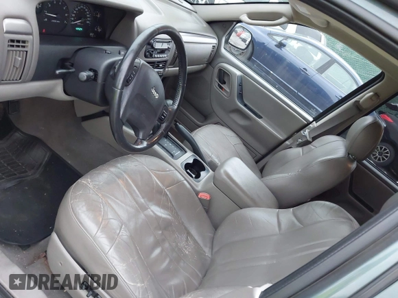 2004 Jeep Grand Cherokee Laredo with VIN 1J4GW48S24C276284, listed as a IAAI auction lot 42596655 with 142,524 mi miles and . Bid and sale history available at DreamBid. Image 15.