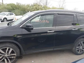 2017 Honda Pilot Touring with VIN 5FNYF6H93HB028122, listed as a IAAI auction lot 42130116 with 109,318 mi miles and . Bid and sale history available at DreamBid. Image 14.
