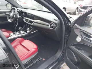 2023 Alfa Romeo Stelvio Ti with VIN ZASPAKBN6P7D56722, listed as a IAAI auction lot 41363962 with 50,073 mi miles. Bid and sale history available at carsss.com. Image 5.
