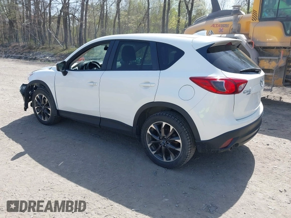 2016 Mazda CX-5 Grand Touring with VIN JM3KE4DY0G0632693, listed as a IAAI auction lot 42123142 with 106,592 mi miles. Bid and sale history available at carsss.com. Image 3.