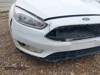 2018 Ford Focus SE z VIN 1FADP3F23JL225333, wystawiony jako IAAI lot #41758445 z przebiegiem 133 307 mil mil oraz . Historia ofert i sprzedaży dostępna na DreamBid. Obrazek 6.