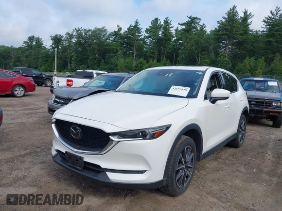 2018 Mazda CX-5 Grand Touring with VIN JM3KFBDM0J0308813, listed as a IAAI auction lot 42657978 with 78,119 mi miles and . Bid and sale history available at DreamBid. Image 2.