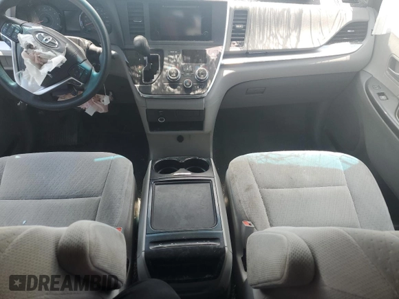 2015 Toyota Sienna LE with VIN 5TDJK3DC4FS107711, listed as a Copart auction lot 57693005 with 141,370 mi miles and Salvage title. Bid and sale history available at DreamBid. Image 8.
