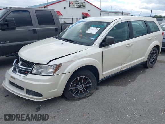 2014 Dodge Journey SE with VIN 3C4PDCAB1ET192530, listed as a IAAI auction lot 41987728 with 186,486 mi miles and . Bid and sale history available at carsss.com. Image 6.