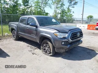 2021 Toyota Tacoma SR z VIN 5TFAX5GN1MX189429, wystawiony jako IAAI lot #41968054 z przebiegiem 43 480 mil mil oraz . Historia ofert i sprzedaży dostępna na DreamBid. Obrazek 1.