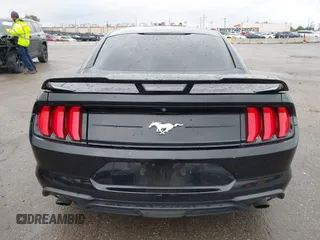 2018 Ford Mustang EcoBoost z VIN 1FA6P8TH3J5129088, wystawiony jako IAAI lot #41792548 z przebiegiem 55 991 mil mil oraz . Historia ofert i sprzedaży dostępna na DreamBid. Obrazek 16.