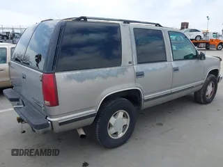 1999 Chevrolet Tahoe Z71 with VIN 1GNEK13R4XJ504675, listed as a IAAI auction lot 42162102 with 320,128 mi miles and . Bid and sale history available at DreamBid. Image 4.