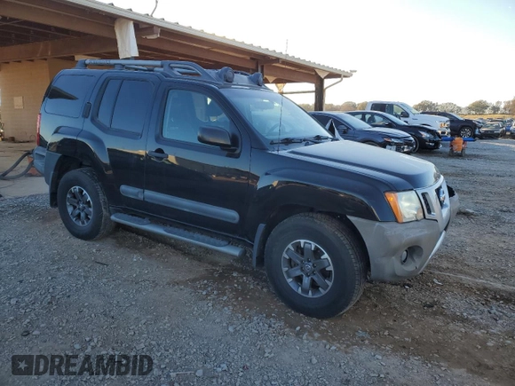 2014 Nissan Xterra X with VIN 5N1AN0NW9EN812437, listed as a Copart auction lot 83905504 with 118,805 mi miles and Salvage Title. Bid and sale history available at DreamBid. Image 4.