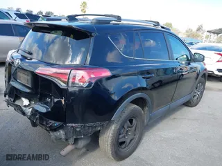 2018 Toyota RAV4 LE with VIN 2T3ZFREVXJW457751, listed as a IAAI auction lot 41529251 with 230,054 mi miles. Bid and sale history available at carsss.com. Image 4.