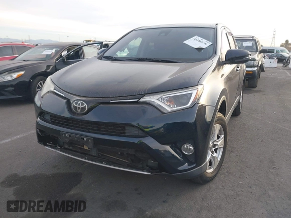 2018 Toyota RAV4 XLE with VIN JTMWFREV2JJ151595, listed as a IAAI auction lot 41380691 with 79,515 mi miles and . Bid and sale history available at carsss.com. Image 17.