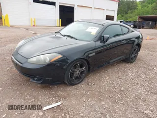 2007 Hyundai Tiburon GT z VIN KMHHN66F37U250320, wystawiony jako IAAI lot #42047654 z przebiegiem 231 899 mil mil oraz . Historia ofert i sprzedaży dostępna na DreamBid. Obrazek 2.