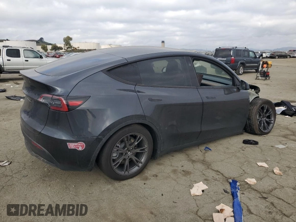 2025 Tesla Model Y Long Range with VIN 7SAYGDED6SF227475, listed as a Copart auction lot 42634345 with 3,493 mi miles and Salvage Title. Bid and sale history available at DreamBid. Image 3.