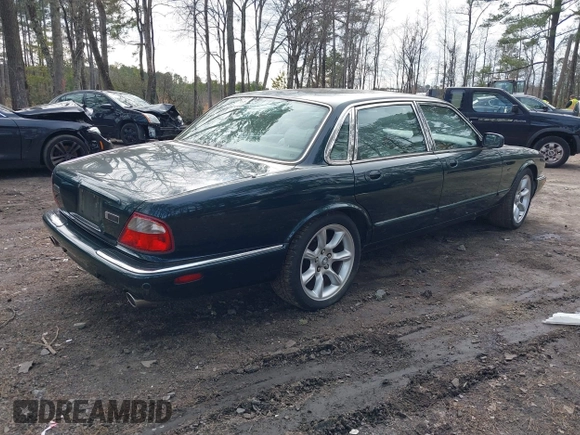 2003 Jaguar XJ with VIN SAJDA15B53MF53212, listed as a IAAI auction lot 41613266 with 180,165 mi miles and . Bid and sale history available at DreamBid. Image 4.