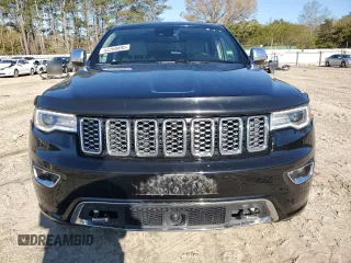 2017 Jeep Grand Cherokee Overland with VIN 1C4RJFCT3HC755960, listed as a Copart auction lot 52268895 with 99,998 mi miles and Salvage title. Bid and sale history available at DreamBid. Image 5.