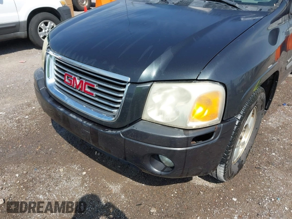 2006 GMC Envoy SLT with VIN 1GKDS13SX62247347, listed as a IAAI auction lot 42031142 with 263,599 mi miles. Bid and sale history available at carsss.com. Image 6.