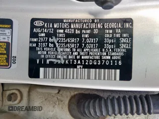 2013 Kia Sorento LX with VIN 5XYKT3A12DG370116, listed as a Copart auction lot 57598675 with 203,902 mi miles and Salvage title. Bid and sale history available at DreamBid. Image 14.