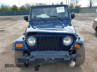 2005 Jeep Wrangler Sport with VIN 1J4FA49S05P384308, listed as a IAAI auction lot 41821354 with 106,394 mi miles. Bid and sale history available at carsss.com. Image 12.