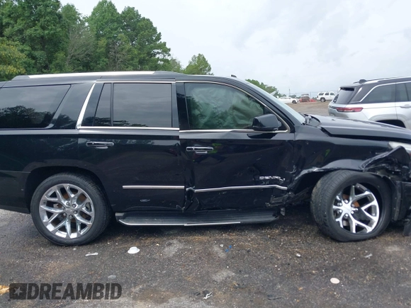 2016 GMC Yukon Denali with VIN 1GKS1CKJXGR254306, listed as a IAAI auction lot 39953539 with 164,149 mi miles. Bid and sale history available at carsss.com. Image 13.
