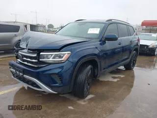 2023 Volkswagen Atlas SE z VIN 1V2WR2CA3PC507742, wystawiony jako IAAI lot #41282782 z przebiegiem 26 052 mil mil oraz . Historia ofert i sprzedaży dostępna na DreamBid. Obrazek 2.