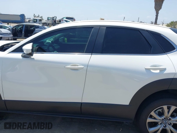 2021 Mazda CX-30 Select with VIN 3MVDMBBL9MM313039, listed as a IAAI auction lot 42575424 with 21,083 mi miles and . Bid and sale history available at DreamBid. Image 14.