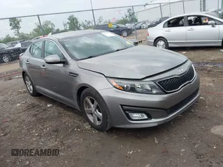 2014 Kia Optima LX z VIN 5XXGM4A71EG291605, wystawiony jako IAAI lot #42274924 z przebiegiem 192 991 mil mil oraz . Historia ofert i sprzedaży dostępna na DreamBid. Obrazek 1.