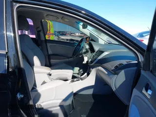 2015 Hyundai Accent Sport with VIN KMHCU5AE8FU233131, listed as a IAAI auction lot 41360461 with 99,480 mi miles. Bid and sale history available at carsss.com. Image 5.