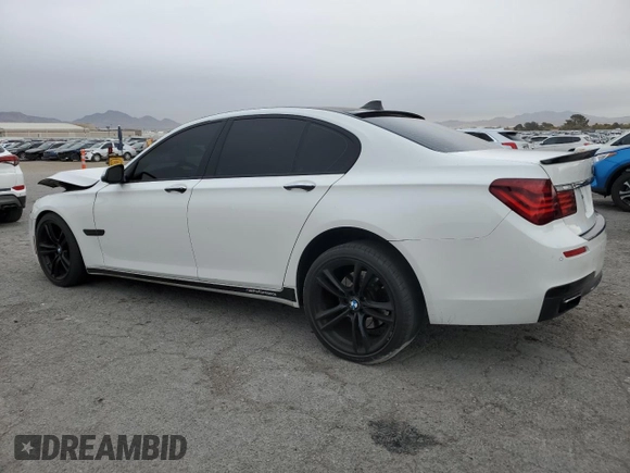 2013 BMW 7 Series 740i with VIN WBAYA6C55DC995290, listed as a Copart auction lot 82022284 with 128,882 mi miles and Salvage Title. Bid and sale history available at carsss.com. Image 2.