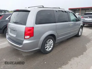 2014 Dodge Grand Caravan SXT with VIN 2C4RDGCG0ER417662, listed as a IAAI auction lot 41933279 with 156,751 mi miles and . Bid and sale history available at DreamBid. Image 4.