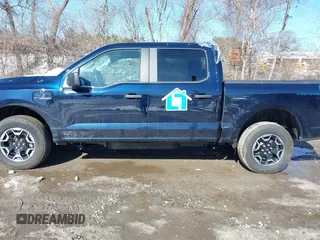 2023 Ford F-150 Lightning Pro with VIN 1FTVW1EL7PWG07081, listed as a IAAI auction lot 38702102 with 9,976 mi miles and . Bid and sale history available at DreamBid. Image 14.