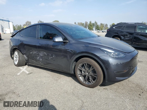 2024 Tesla Model Y Long Range with VIN 7SAYGDEE2RA244242, listed as a Copart auction lot 52635095 with 4,994 mi miles and Salvage title. Bid and sale history available at DreamBid. Image 4.