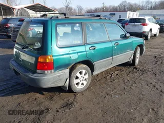 1999 Subaru Forester L with VIN JF1SF635XXH735202, listed as a IAAI auction lot 41489355 with 290,000 mi miles. Bid and sale history available at carsss.com. Image 4.