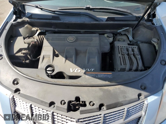 2011 Cadillac SRX z VIN 3GYFNGEY2BS575063, wystawiony jako Copart lot #60846875 z przebiegiem 158 590 mil mil oraz Szkoda całkowita • Salvage title. Historia ofert i sprzedaży dostępna na DreamBid. Obrazek 12.